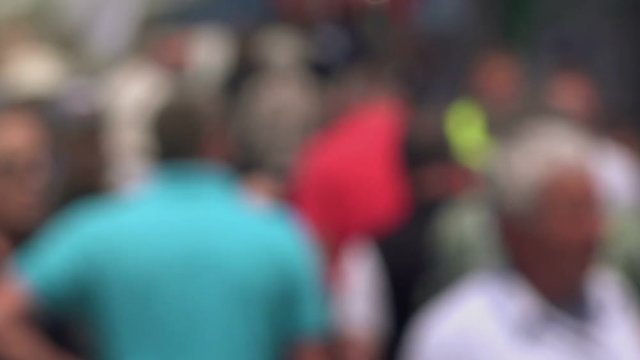 Blur crowd of people, pedestrians walking on city street