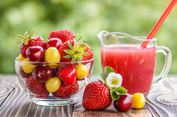 strawberry, cherry white and red in bowl and juice