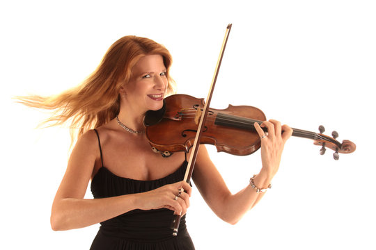 A laughing woman plays a violin