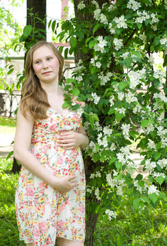 Pregnant woman park apple tree