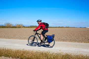 Biker MTB cycle tourism with panniers in Spain