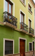 Fototapeta na wymiar Denia street Loreto facades in Alicante spain