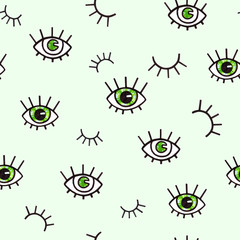 Seamless pattern with eyes on a green background. Bohemian style background for design. Abstract print of open and close eyes. Handwork drawing. Visual art direction