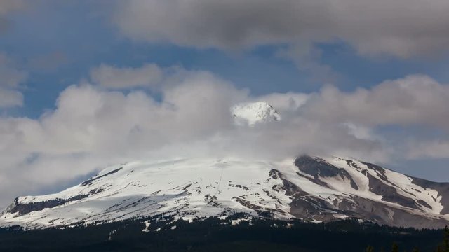 Ultra high definition 4k time lapse movie of moving clouds and fog over majestic Mount Hood in Oregon closeup 4096x2304