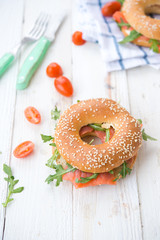 Bagels with arugula and a salmon
