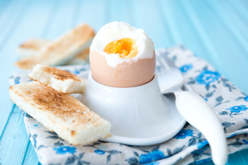 Boiled egg with wheat croutons
