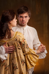 Beautiful couple woman and man in medieval clothes