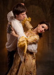 Beautiful couple woman and man in medieval clothes