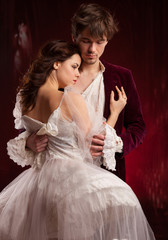 pretty young lady in old time and man in red medieval dress  © Dmytro Sandratskyi