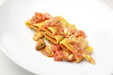Dish of Paccheri pasta with seafood chowder sauce