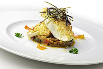 Fish dish Fillet of Turbot with eggplant pie and almonds