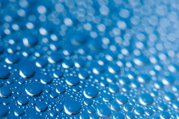 close-up of water drops on the blue background