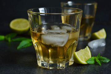 cool rum iced lime and mint on black background