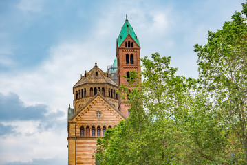 old historic church, cloudy sky and trees