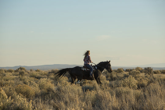 Woman riding horse
