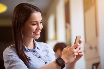 Pleasant woman using  cell phone 