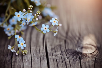 Forget-me-nots on a wooden table