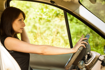 Obraz na płótnie Canvas Woman driving car. Summer vacation trip travel.