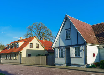 Fototapeta na wymiar Houses with wooden fence in Ventspils of Latvia
