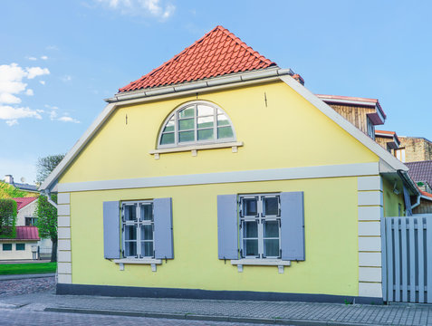 Yellow painted Old house in Ventspils of Latvia
