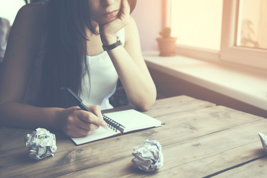 young woman writing
