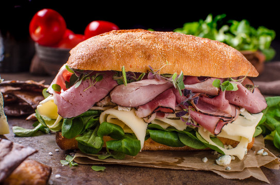 Sandwich with ham and cheese, lettuce