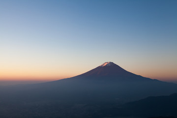 View of Mountain Fuji and Kawaguchiko lake in morning autumn season seen from Shindotoge view point