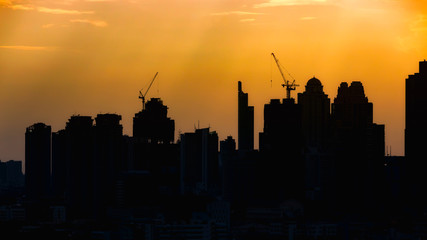 Silhouete city with construction site for background.