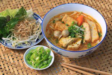 Tray of vegetarian rice noodle soup and side dishes