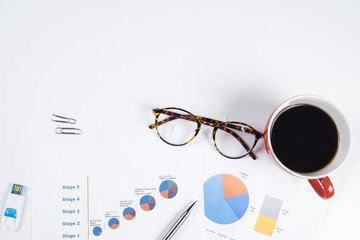 Mix of office supplies and gadgets on a white table background.