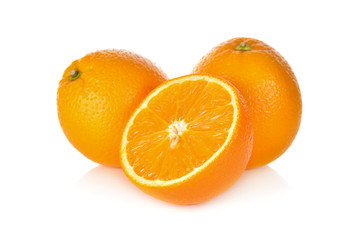 whole and cut ripe orange on white background