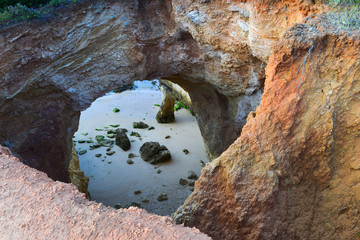 Sea caves on the coast of Portimao. Algarve region. Portugal