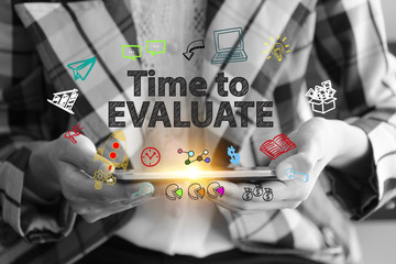 business holding a smart phone  with TIME TO EVALUATE  text 