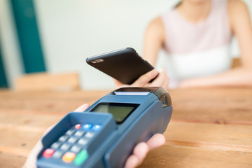 Woman checkout by mobile phone