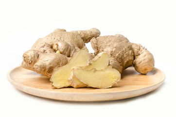 Fresh ginger on wooden plate 