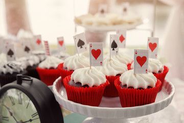 .Red velvet cupcakes with playing cards toppers, Alice in wonderland tea party theme,toning