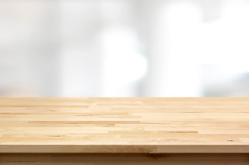 Wood table top on blur white gray abstract background