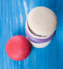 Multicolored macaroon on blue boards.