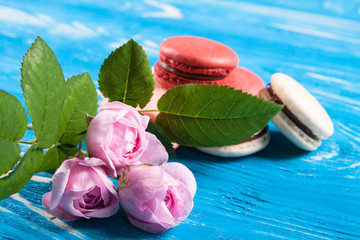 Multicolored macaroon on blue boards.