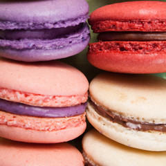 Multicolored macaroon on blue boards.