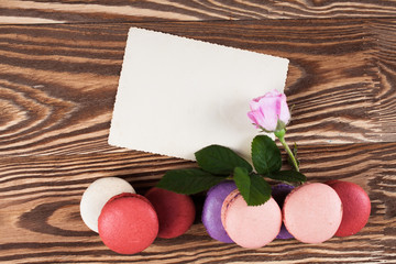Multicolored macaroon on brown boards.