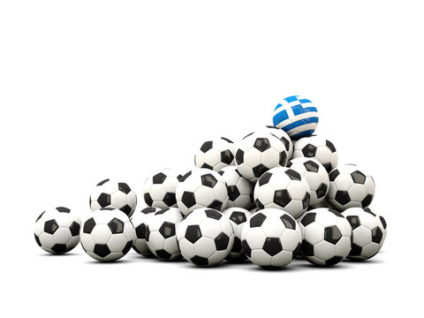 Pile of soccer balls with flag of greece
