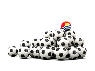 Pile of soccer balls with flag of kiribati