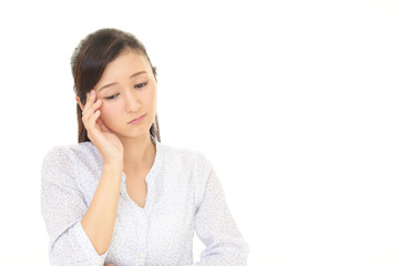 頭痛をうったえる女性
