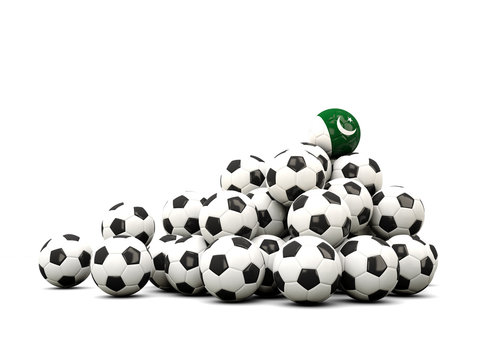 Pile of soccer balls with flag of pakistan