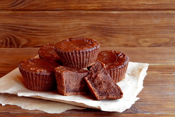 Chocolate cupcakes recipe. Sweet delicious cupcakes made from butter, cocoa, chocolate, sugar, flour, eggs. Oven baked muffins. Close-up