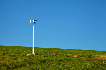 Anemometer in the park against the blue sky