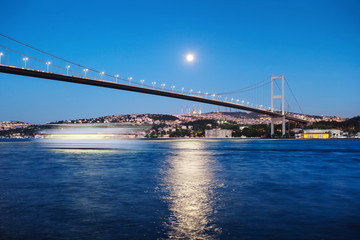 Fototapeta na wymiar Bosphorus Bridge with track of the ship