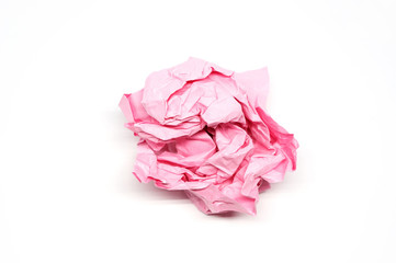 Crumpled pink paper ball isolated on a white background
