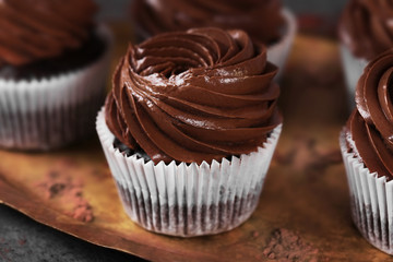 Chocolate cupcakes on a tray, close up